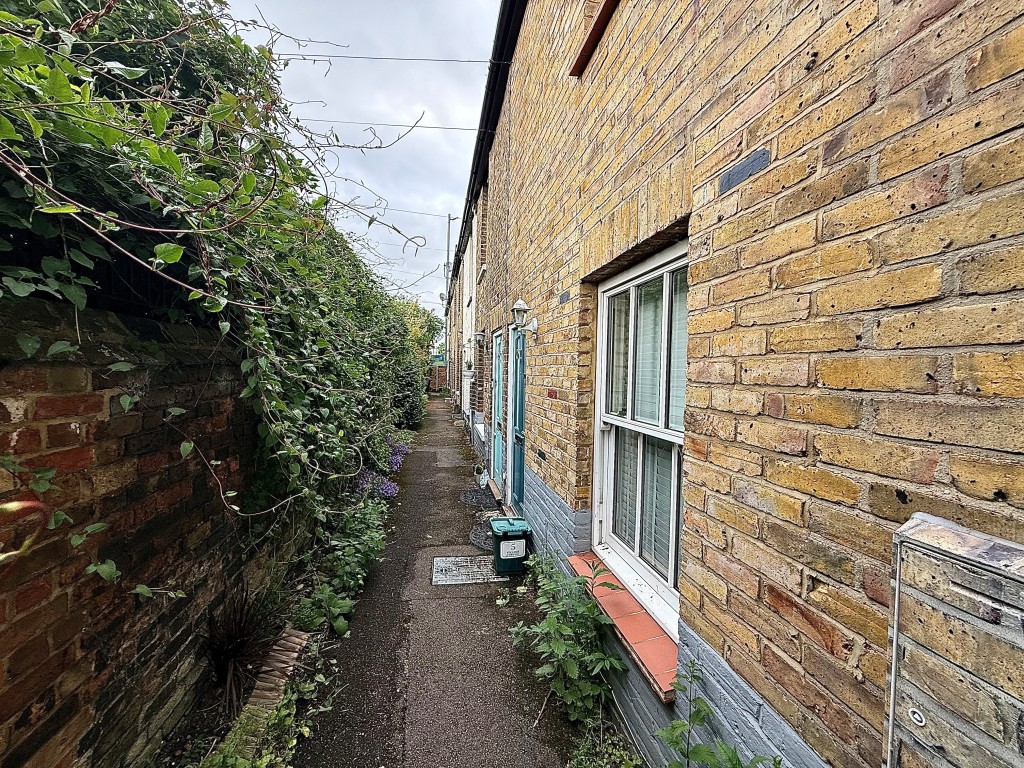 Lot: 76 - TWO-BEDROOM MID-TERRACE HOUSE FOR IMPROVEMENT - Alley way showing access to the property